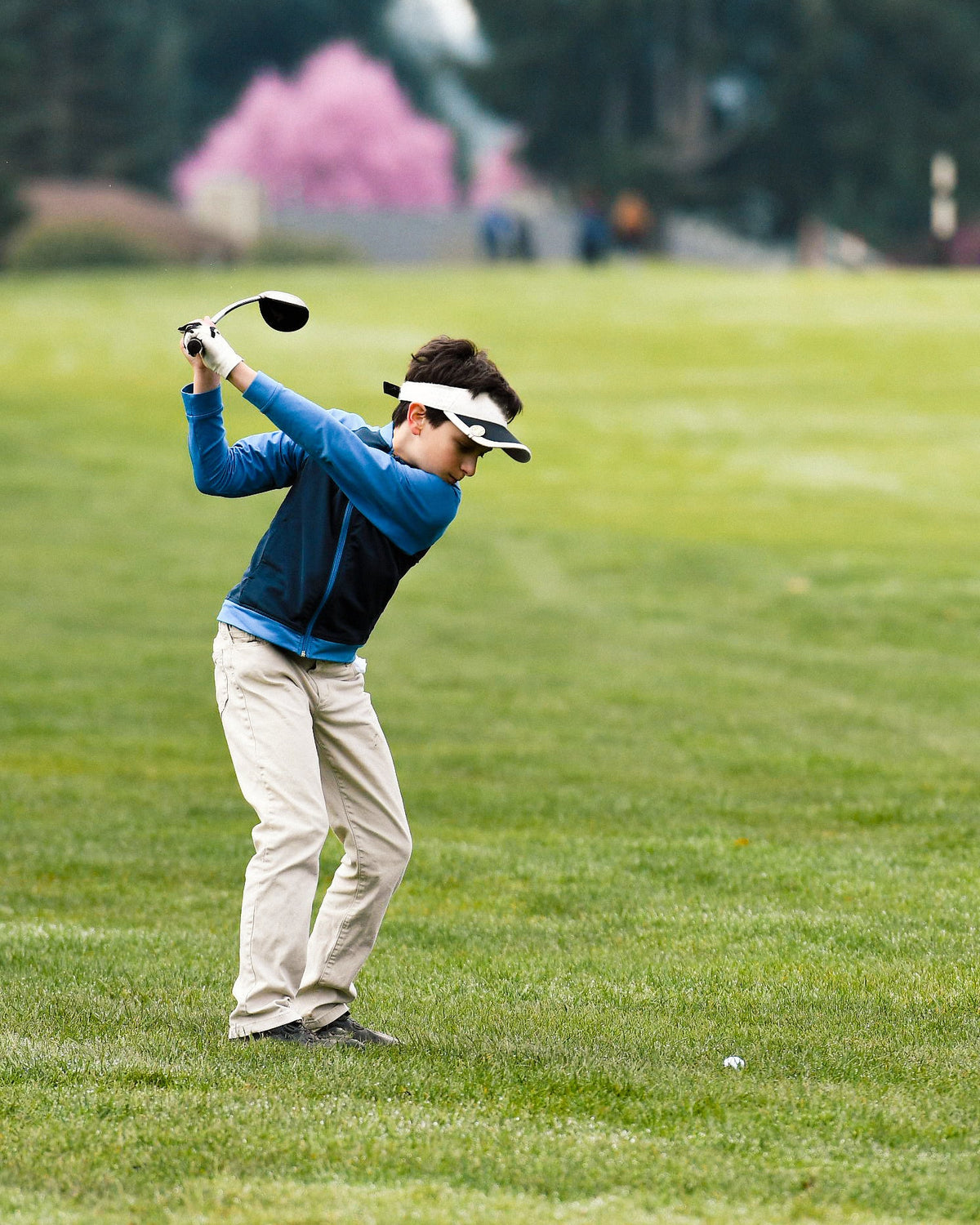 Junior golfer training with SuperSpeed speed sticks