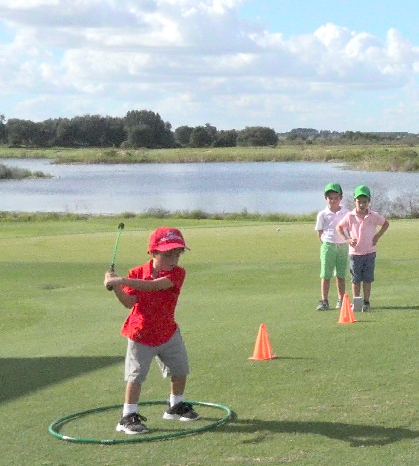 Junior golfer training swing speed with SuperSpeed Golf